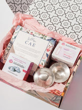 Silverette Nurturing Essentials Bundle gift box with sterling silver nursing cups and breastfeeding care products