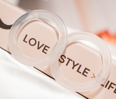 Close-up of O-Feel silicone rings printed with Love, Style, Life